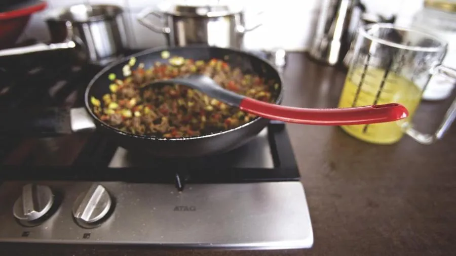 Bolognese sauce cooking in a pan on the stovetop